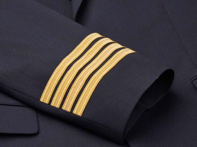 Four golden stripes on jacket