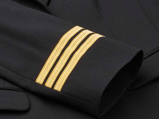 Three golden stripes on jacket